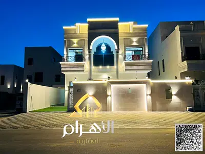 Villa for sale, including registration and ownership fees, near all services, close to Sheikh Mohammed Bin Zayed Road, on a main street, very prime lo