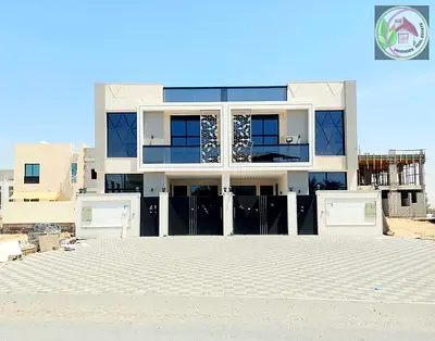 Own your dream two-story villa in the Al Yasmin area, next to Al Hamidiya Park, directly from the o