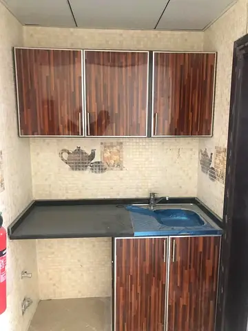 Professional English Advertisement (Around 150 Words) Studio apartment available for annual rent in Al Rashidiya 2, conveniently located next to Falc