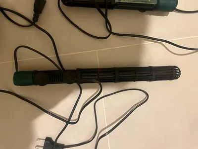 Two Submersible Aquarium Heaters (sera 300w and 100w); filter, gravel cleaner, air pump