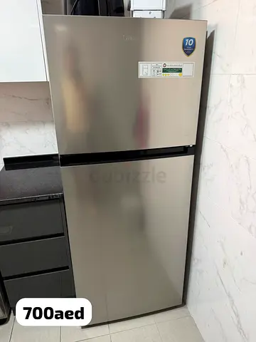 Good condition 2-door Candy fridge - 700 AED