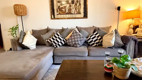 Spacious L-shaped Grey Fabric Sofa with Chaise and Cushions