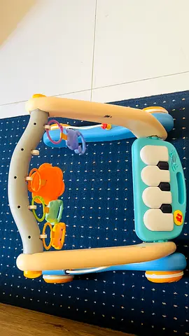 Baby activity walker with piano and hanging toys - good condition