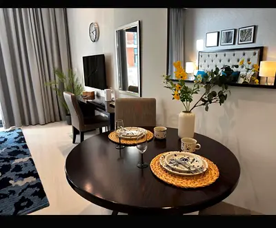 My round dark wood dining table only without chairs (110cm diameter) free of charge