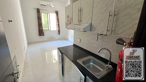 Rawda 2 Studio on Sheikh Ammar Street, semi-detached kitchen, prime location, immediate occupancy, elegant design, near the Dubai and Sharjah exit, cl
