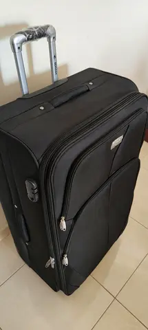 Large black fabric roller suitcase with telescopic handle – good condition     size 50x80x30