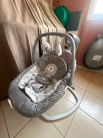 Gently used gray baby swing / rocker - comfy seat with toy bar