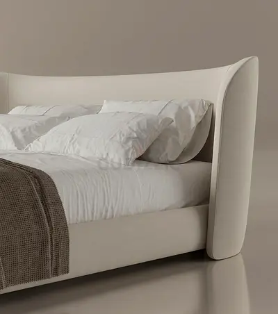 Modern upholstered king-size bed with curved headboard