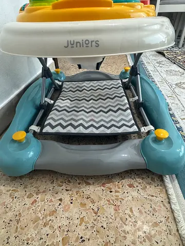 Juniors baby walker with adjustable seat and activity tray - good condition