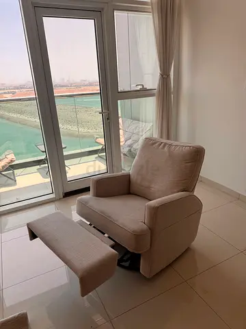 Beige Upholstered Armchair with Ottoman - Good Condition