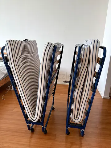 One Foldable Single Guest IKEA Bed with Mattresses - Good Condition