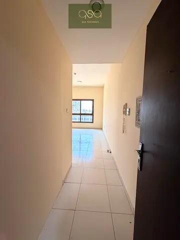 Fully Renovated 2BHK Apartment with Living Area, Close Kitchen, Kids Play Area & Building Parking for Rent in Emirates City Ajman