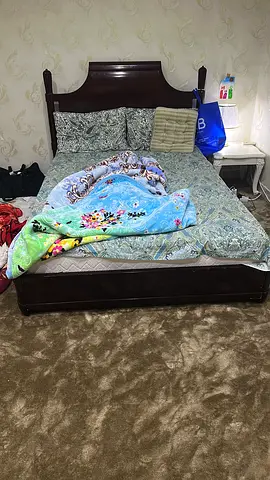 Dark wood double bed frame with headboard - good condition