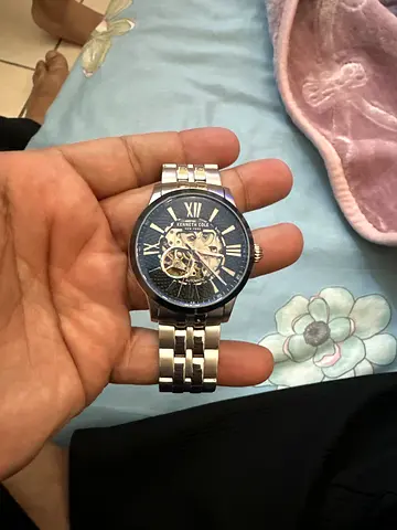Mens automatic Kenneth Cole skeleton wristwatch with metal bracelet