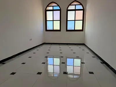 One-bedroom apartment for annual rent near Sheikh Ammar Street and Sheikh Zayed Road, with 2 bathrooms, balcony, and central air conditioning.