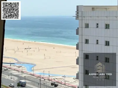 Annual apartment for rent in Ajman, 2 master rooms, sea view, laundry room, 4 baths, American kitchen, wardrobes, free parking, 4 payments only. good