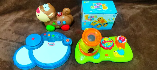 Bundle of baby activity toys — drums, spinning activity toy and pull-along dog (used)