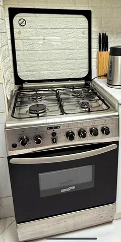 Used 4-Burner Gas Stove with Oven - Good Working Condition