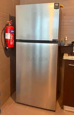 Silver top-freezer refrigerator - good condition, energy efficient