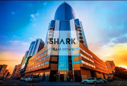 Two-bedroom apartment with a living room in Al Rashidiya 1, sea view, 2 bathrooms, balcony, spacious area, and includes parking in a prime and vibrant