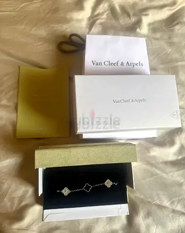 Van Cleef  Arpels Alhambra Bracelet (silver/white motifs) with box and paperwork
