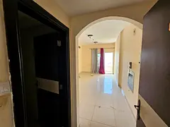 Free parking, two bedrooms and a living room with a balcony and open view in Al Taawun