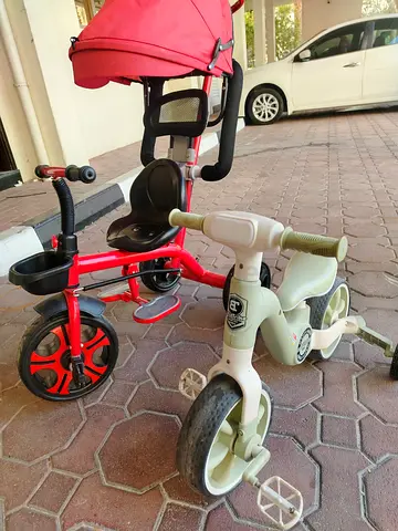 Two kids tricycles - one convertible stroller-trike and one simple trike - good condition