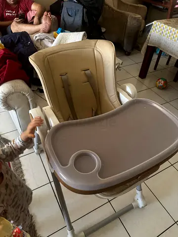 Used beige baby high chair with removable tray foldable