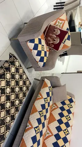 Beige upholstered 7-seater sofa with patterned cushions — New condition