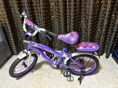 Purple kids 14-inch bicycle with training wheels - good condition