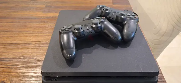 Sony PlayStation 4 Slim with 2 Controllers - Good Working Condition