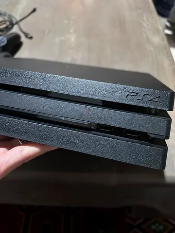 PS4 with controller and games