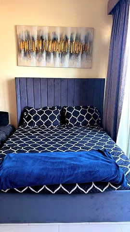 Queen upholstered bed frame with headboard and storage in grey color - good condition