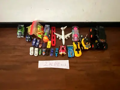 Mixed toy vehicles lot — cars, trucks, plane (2 AED each)