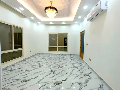 Villa for sale in Al Yasmin, next to Al Hamidiya Park, first occupancy, consisting of 5 master bedrooms, a living room, a hall, and a maid's room.
