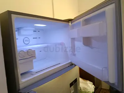 Used double-door refrigerator (top freezer) - stainless steel, working condition