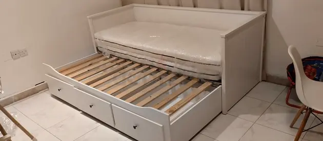 IKEA Hamnes Day bed with 3 storage drawers underneath and with 2 IKEA mattresses is available