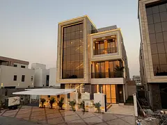 Luxury villa for sale in Al Yasmin, Ajman, directly overlooking Al Hamidiya Park. Corner location wi