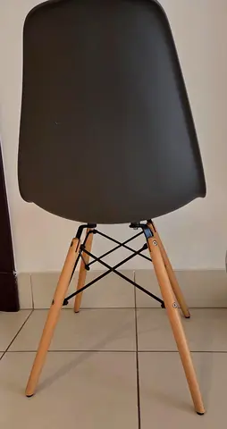 Set of modern dining chairs with wooden legs (single chair shown)