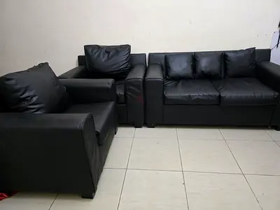 Black faux leather 4-seater sofa