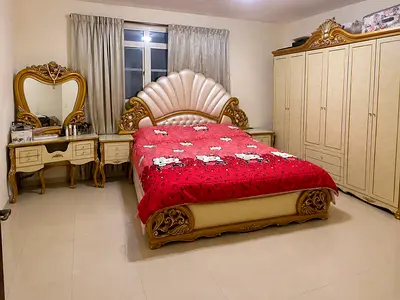 Queen-sized ornate bedroom set with bed, wardrobe and dressing table