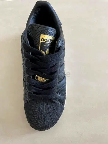 Black Adidas Superstar XLG sneakers with gold accents - used, size 42
