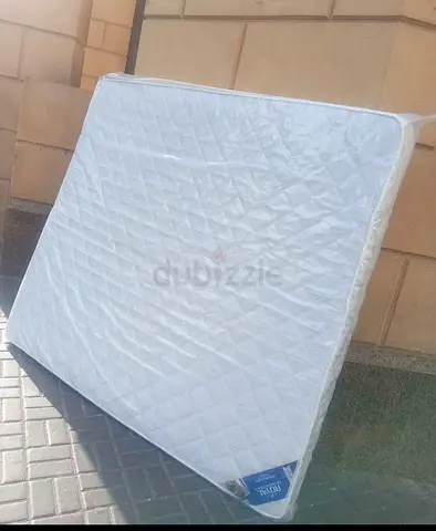 Queen size mattress - barely used, clean and wrapped