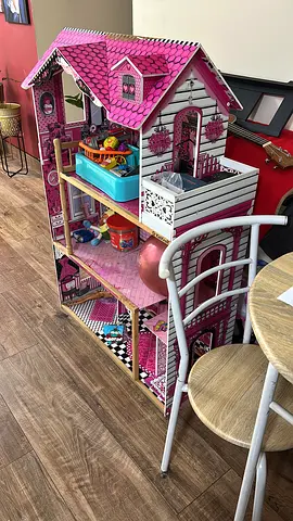 Large Pink Dollhouse with Multiple Rooms and Furniture