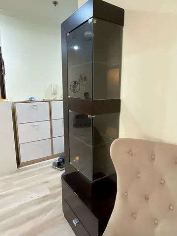 Tall dark wood display cabinet for show piece with glass doors and drawer - good condition