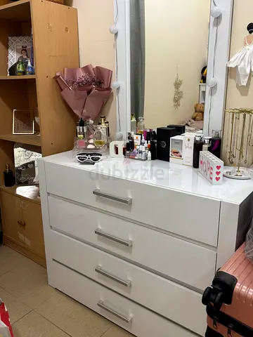 Bed with beside table with dresser