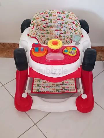 Red and white baby walker with activity tray - good used condition