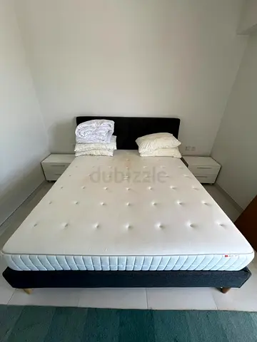 Queen bed frame with mattress and two nightstands