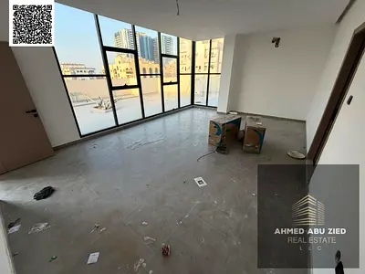 Brand new luxury studio with large roof for rent in Ajman. Separate kitchen, modern bathroom, full maintenance, near services and transport, easy paym