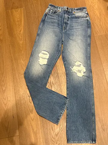 Light blue ripped womens jeans by Khaite - size 29 (good condition)